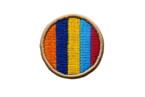 Colorful embroidered patch with vertical stripes in orange, yellow, blue, and red. Circular design with a beige border. png