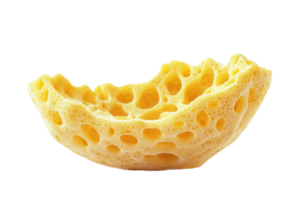 Close-up image of a yellow sponge with large, noticeable pores, isolated on a transparent background. Ideal for cleaning or hygiene concepts. png