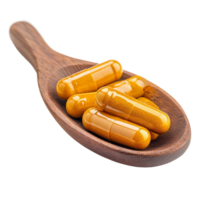 Turmeric capsules arranged in a wooden spoon against a transparent background for natural health remedies, Turmeric Capsule in wood spoon on transparent background png