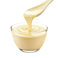 Deliciously smooth condensed milk being poured from a spoon into a clear glass bowl on a transparent background, Condensed milk isolated on transparent background Stock Photo png