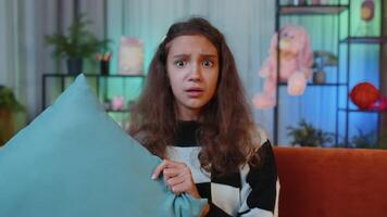 Upset girl looking with rage aggression, scolding protest, fighting with pillow to camera, quarrel video