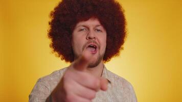 Man pointing to camera and looking with playful happy expression making choice of lucky winner video
