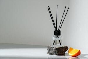 Aromatic Reed Diffuser on a Stone Base With Orange Slice Accent photo