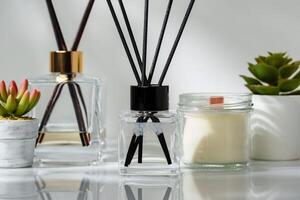 Elegant Home Fragrance Reed Diffuser Displayed Beside Scented Candles and Succulents photo