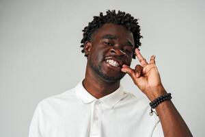 African Man Making a Hush Gesture With Finger photo