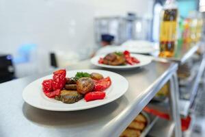 Assorted Gourmet Dishes Displayed on Shelves in a Modern Deli photo