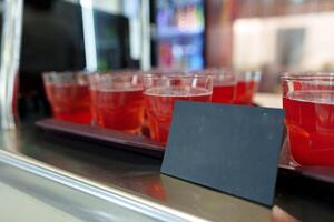 Colorful Array of Fruit Juice Cups on a Serving Cart in a Cafeteria photo