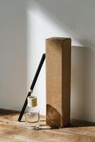 Elegant Reed Diffuser With Shadows on Wooden Surface in Soft Morning Light photo