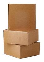 Stacked brown cardboard boxes in various sizes arranged on a white background photo