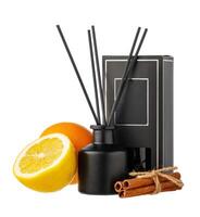 Aromatic diffuser with orange and cinnamon scent on white background photo