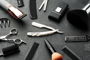 Set of tools for hairdressing and barbershop on gray background photo