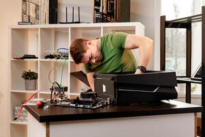 Man assembles a computer system unit at home photo