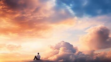 A person in contemplative solitude admires a vibrant sunset sky filled with colorful clouds and serene beauty during twilight photo