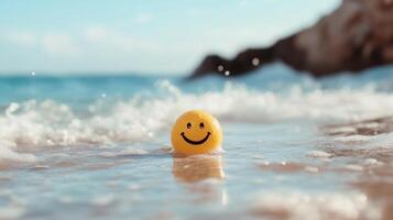A cheerful yellow ball with a smiley face floating on gentle ocean waves at a sunny beach photo