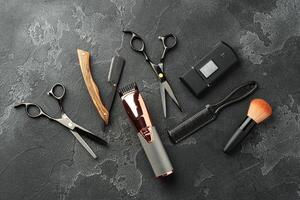 Set of tools for hairdressing and barbershop on gray background photo