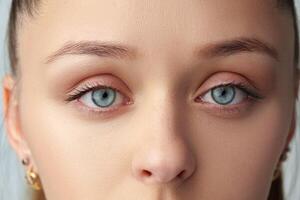 Close up of a young woman with nude make up photo