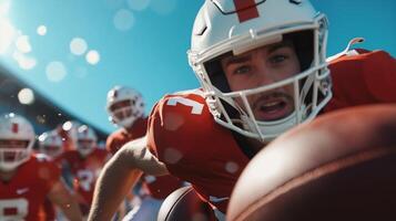 A football player reaches for the ball during a practice session under clear skies at a stadium on a sunny afternoon photo