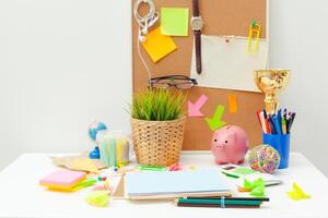 Work place of a creative person with a variety of colorful stationery objects photo