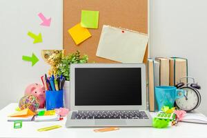 Work place of a creative person with a variety of colorful stationery objects photo