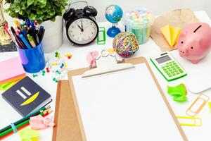 Work place of a creative person with a variety of colorful stationery objects photo