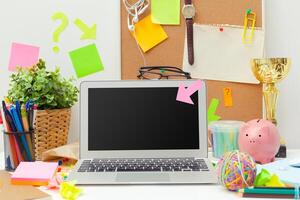 Work place of a creative person with a variety of colorful stationery objects photo
