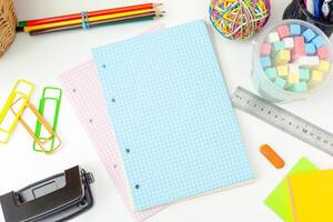 Work place of a creative person with a variety of colorful stationery objects photo