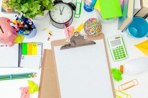 Work place of a creative person with a variety of colorful stationery objects photo