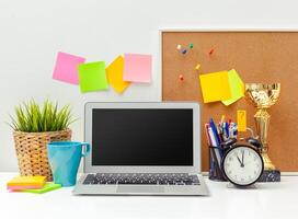 Work place of a creative person with a variety of colorful stationery objects photo