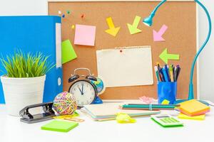 Work place of a creative person with a variety of colorful stationery objects photo