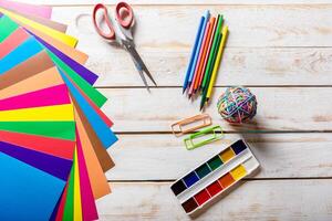 School tools. On a wooden background. photo