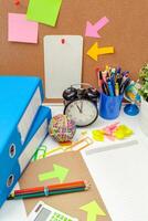 Work place of a creative person with a variety of colorful stationery objects photo