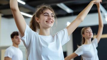 Teenagers practicing dance routines in a bright studio during an afternoon class photo