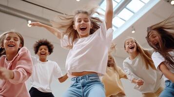 Joyful children dancing together in a bright studio during a fun group activity on a sunny day photo