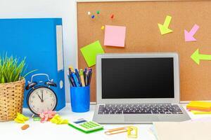 Work place of a creative person with a variety of colorful stationery objects photo