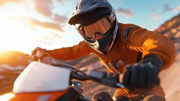 Sunset dirt bike ride through rugged terrain with an adventurous rider in protective gear photo