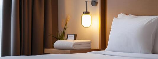 Cozy hotel room featuring a comfortable bed, soft bedding, and warm lighting in a serene setting photo