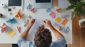 Creative workspace with origami designs and notes during a productive afternoon of brainstorming and planning in a bright home office photo