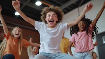 Joyful group of children celebrating together indoors during a fun activity session in a bright recreation center photo