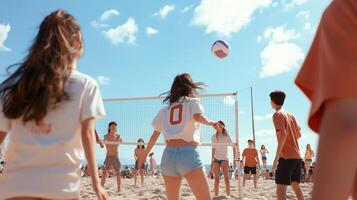 A lively beach volleyball game takes place under a sunny sky with friends enjoying their time on a warm summer afternoon photo