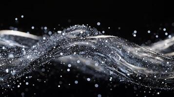 Graceful ripples of water create a mesmerizing display of light and droplets against a dark background in a serene moment photo