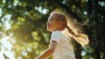 A young girl joyfully rides a pony in a sunlit park, surrounded by greenery on a beautiful summer afternoon photo