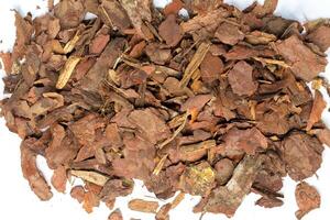 heap of pine bark isolated photo