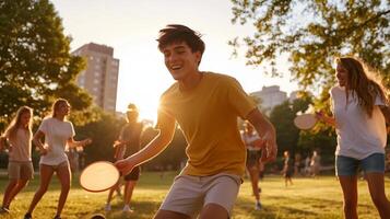 Group of friends playing frisbee in a sunlit park during late afternoon hours in a city setting photo