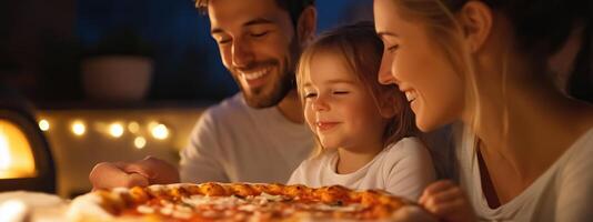 A family enjoys a homemade pizza together at night, creating joyful memories in their cozy kitchen photo