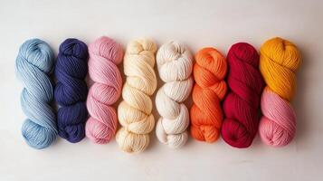 Vivid spools of yarn arranged in a colorful gradient for crafting inspiration at a creative studio photo