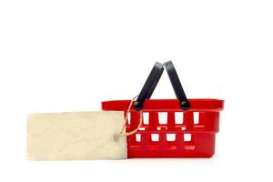 shopping cart with empty price tag isolated on white background photo