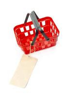 shopping cart with empty price tag isolated on white background photo