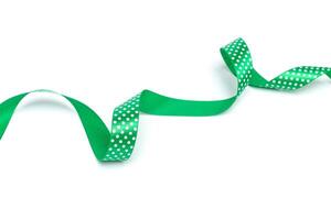 a green ribbon isolated on white background photo