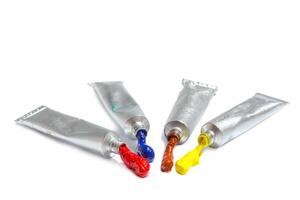 paint in tubes isolated on white photo