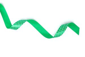 a green ribbon isolated on white background photo